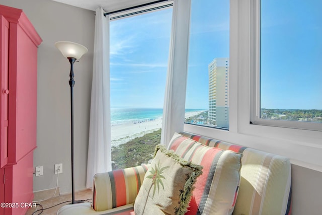 interior space featuring a water view and a view of the beach