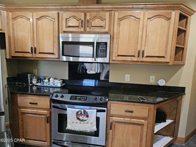 4408 Bylsma Cir, Panama City, FL 32404 - kitchen featuring appliances with stainless steel finishes, open shelves, and dark stone counters