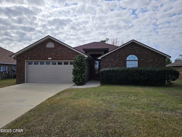 view of front of property with a front yard and a garage