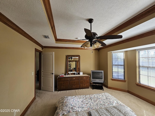 carpeted bedroom featuring ceiling fan, vaulted ceiling, crown molding, and a textured ceiling