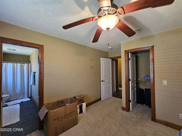 4408 Bylsma Cir, Panama City, FL 32404 - bedroom featuring baseboards, a spacious closet, ceiling fan, a closet, and carpet flooring