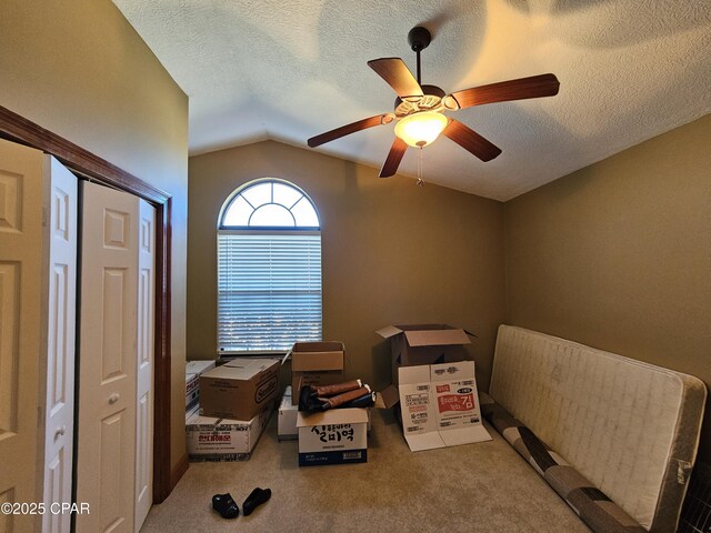 4408 Bylsma Cir, Panama City, FL 32404 - carpeted bedroom with lofted ceiling, a textured ceiling, and a ceiling fan
