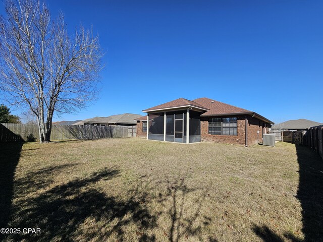 4408 Bylsma Cir, Panama City, FL 32404 - back of house with central air condition unit, a sunroom, and brick siding