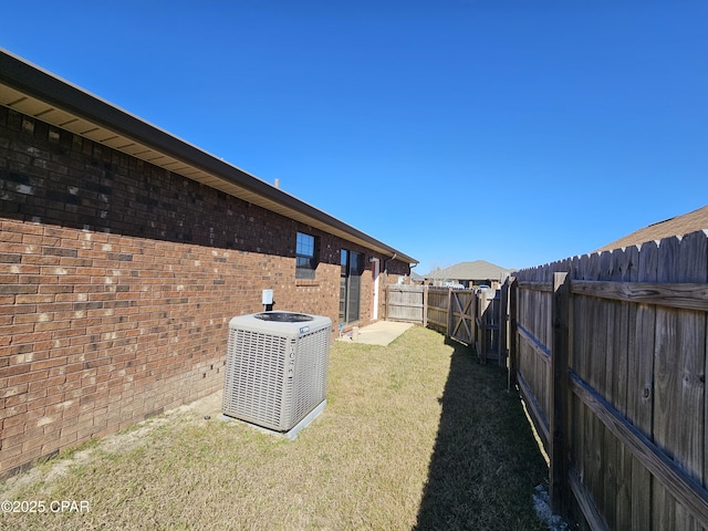 view of yard with central AC