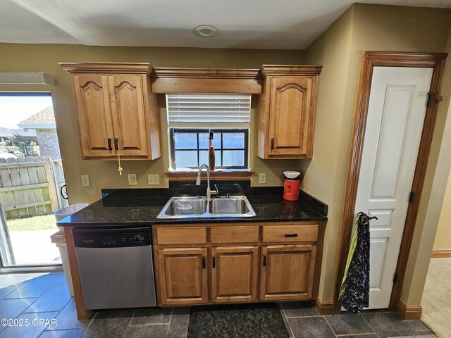 4408 Bylsma Cir, Panama City, FL 32404 - kitchen with stainless steel dishwasher, a sink, and brown cabinetry