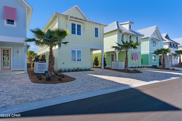 13639 Banana Wind Way, Panama City Beach, FL 32413 - view of front of house with board and batten siding and driveway