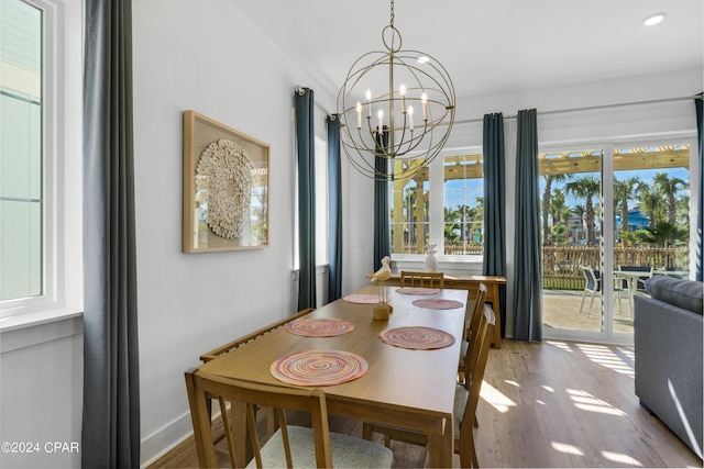 13639 Banana Wind Way, Panama City Beach, FL 32413 - dining area with a chandelier, wood finished floors, recessed lighting, and baseboards