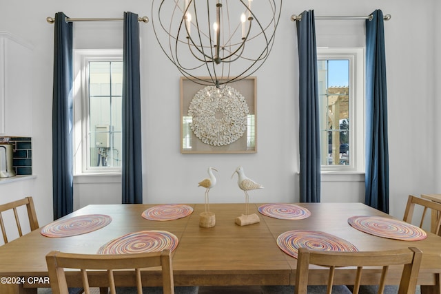 13639 Banana Wind Way, Panama City Beach, FL 32413 - dining space featuring a chandelier and healthy amount of natural light
