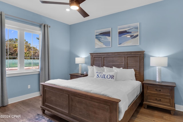 13639 Banana Wind Way, Panama City Beach, FL 32413 - bedroom featuring baseboards, wood finished floors, and a ceiling fan