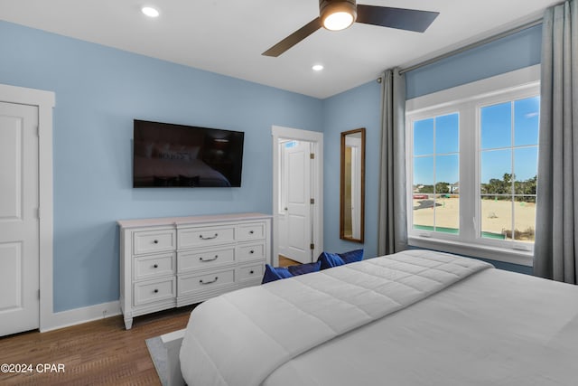 13639 Banana Wind Way, Panama City Beach, FL 32413 - bedroom with dark wood finished floors, baseboards, recessed lighting, and ceiling fan