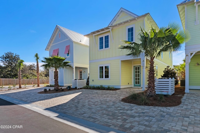 13639 Banana Wind Way, Panama City Beach, FL 32413 - view of front of house with board and batten siding and cooling unit