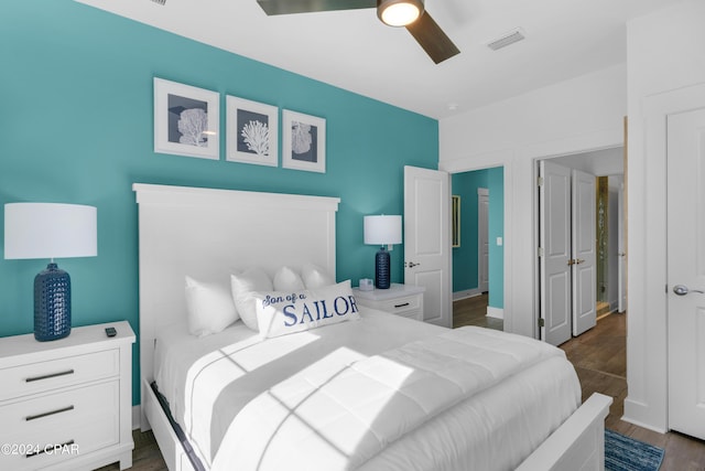 13639 Banana Wind Way, Panama City Beach, FL 32413 - bedroom featuring dark wood-style floors and ceiling fan