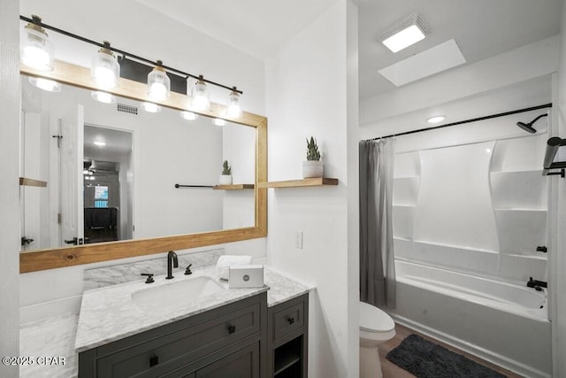 full bathroom featuring visible vents, shower / bathtub combination with curtain, toilet, and vanity