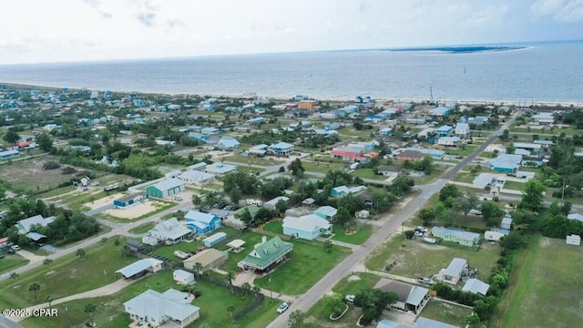 birds eye view of property with a water view and a residential view