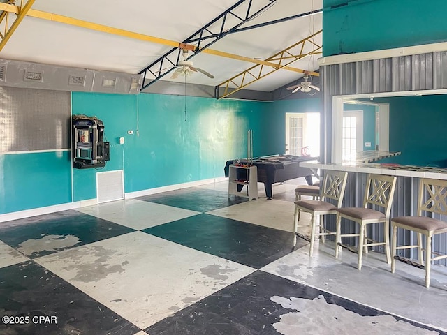 game room with lofted ceiling and visible vents