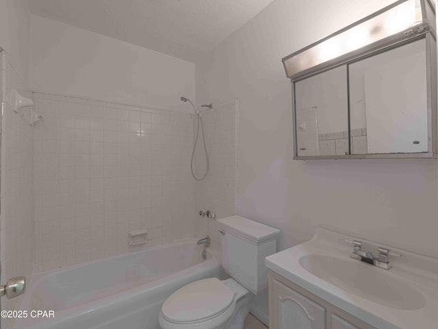 bathroom with toilet, vanity, and washtub / shower combination