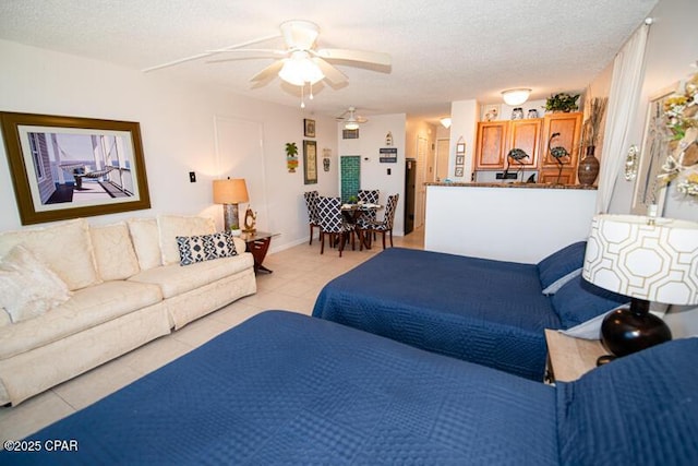 8817 Thomas Dr Unit A618, Panama City Beach, FL 32408 - living area with ceiling fan, light tile patterned flooring, and a textured ceiling