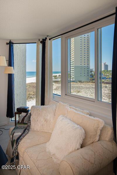 8817 Thomas Dr Unit A618, Panama City Beach, FL 32408 - living area with healthy amount of natural light and a water view