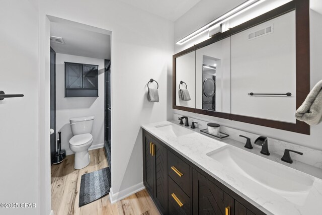 4725 Bay Point Rd Unit 258, Panama City, FL 32408 - bathroom featuring vanity, hardwood / wood-style floors, and toilet