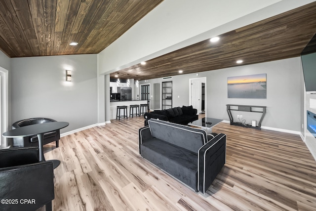 living room featuring wood ceiling and light hardwood / wood-style flooring