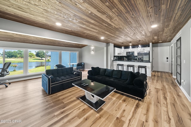 4725 Bay Point Rd Unit 258, Panama City, FL 32408 - living room featuring a water view, wood ceiling, and light hardwood / wood-style flooring