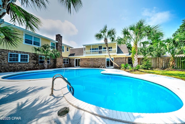 view of pool with a patio area, fence, and a fenced in pool