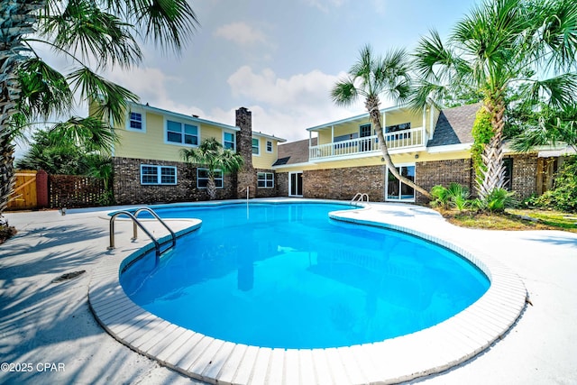 view of pool with fence and a fenced in pool