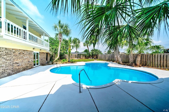 view of swimming pool with a patio area, a fenced backyard, and a fenced in pool