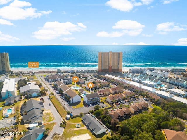 bird's eye view featuring a beach view and a water view