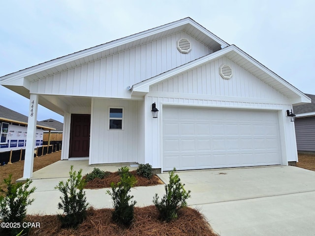 single story home with a garage and driveway