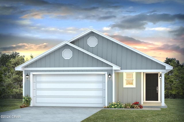 view of front of home with board and batten siding, concrete driveway, an attached garage, and a front yard