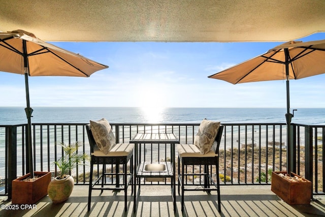 balcony featuring a water view