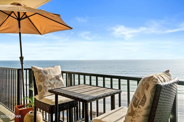 balcony featuring a water view