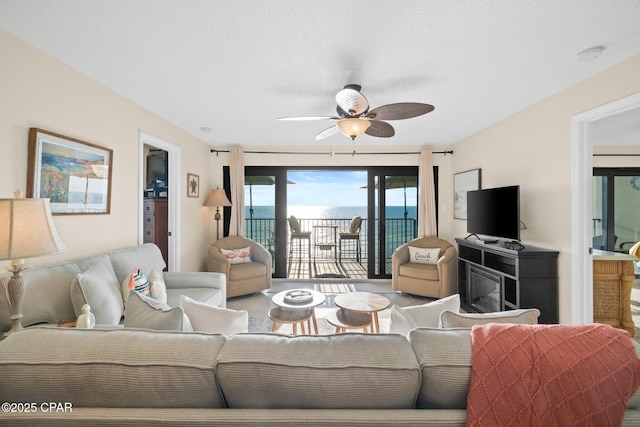 living area with ceiling fan