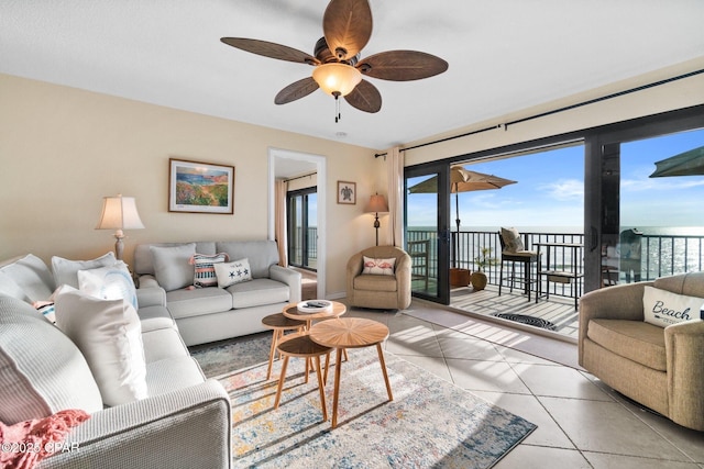 living room featuring tile patterned flooring and ceiling fan