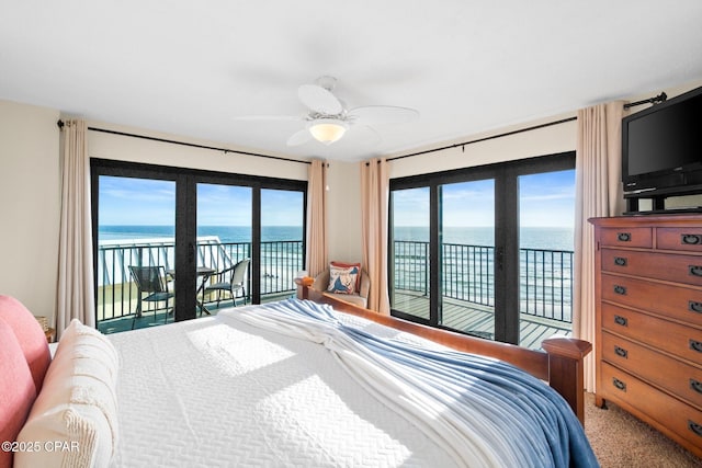 bedroom with access to outside, a ceiling fan, and carpet flooring