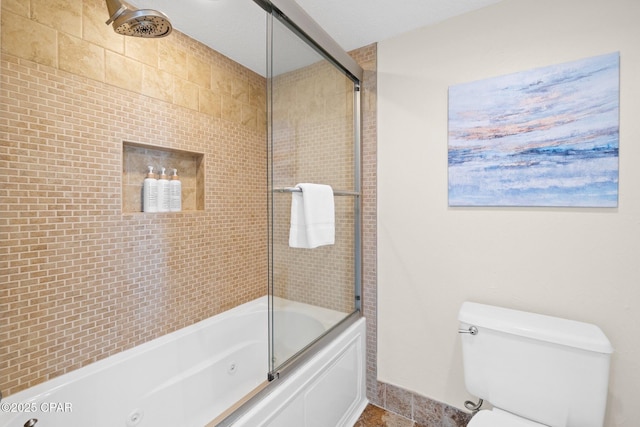 full bathroom featuring a combined bath / shower with jetted tub and toilet