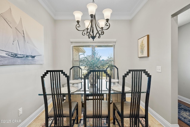 dining area with crown molding and an inviting chandelier