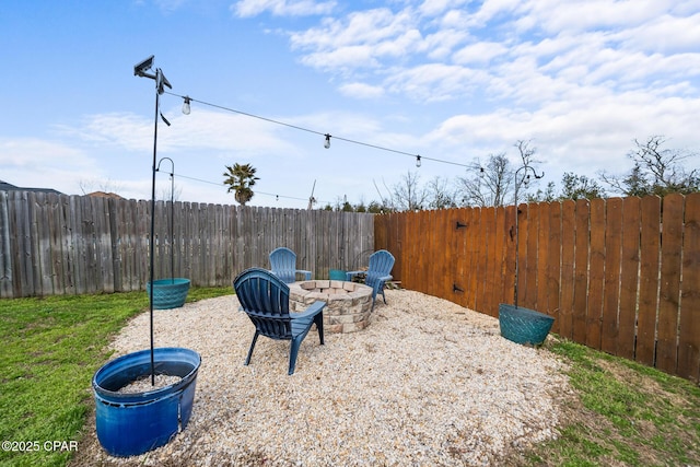 view of yard featuring a patio and a fire pit