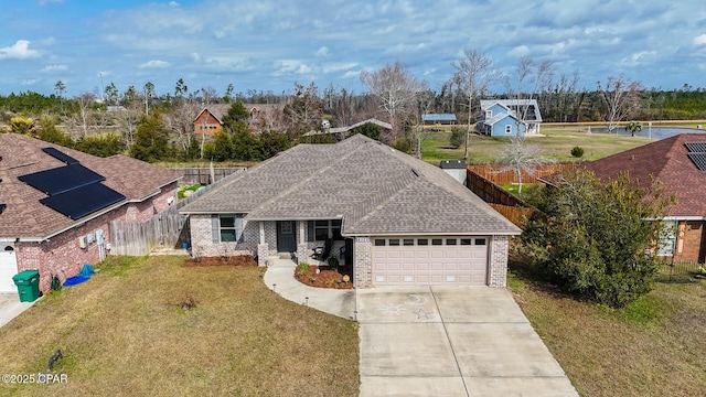 view of front of property featuring a front yard and a garage