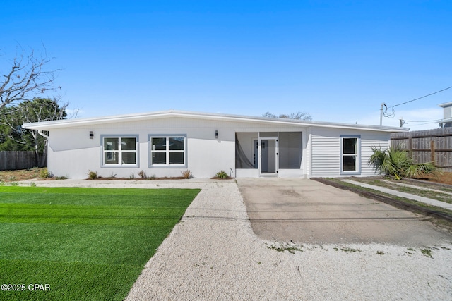 ranch-style house with a front yard