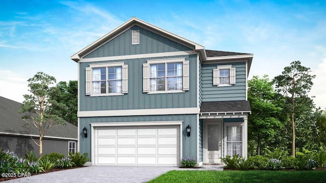 view of front of property featuring concrete driveway, an attached garage, and a shingled roof