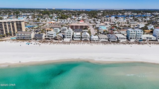 aerial view featuring a water view and a beach view