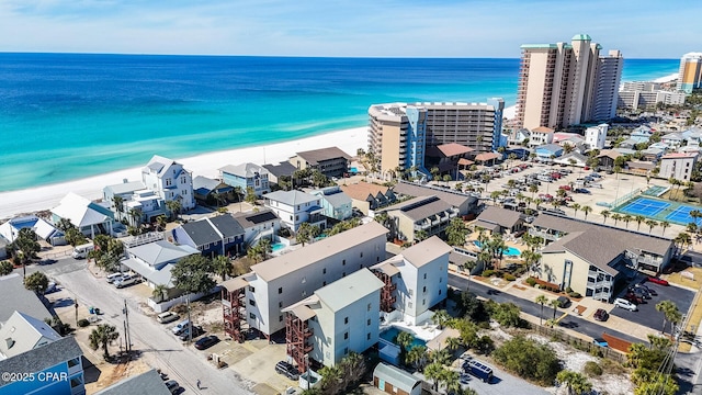 aerial view with a beach view, a water view, and a city view