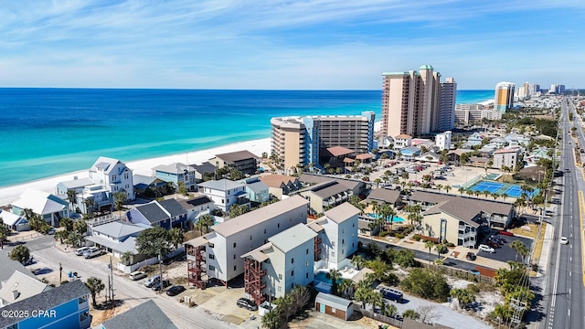 birds eye view of property featuring a view of the beach, a view of city, and a water view