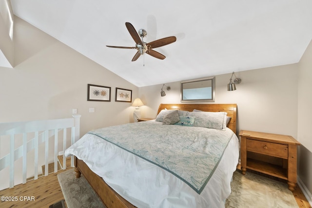 bedroom featuring vaulted ceiling, ceiling fan, and wood finished floors