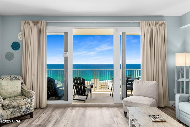 9860 S Thomas Dr Unit 1919, Panama City, FL 32408 - living room featuring a water view and wood finished floors