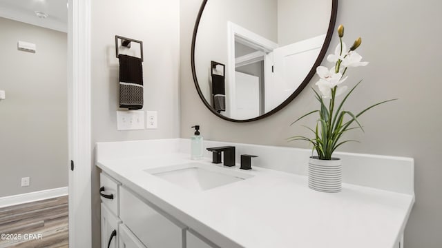 bathroom featuring hardwood / wood-style flooring and vanity