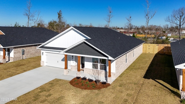 view of front facade with a front yard and a garage