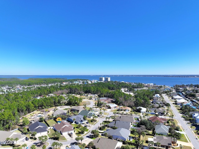 drone / aerial view featuring a water view and a residential view